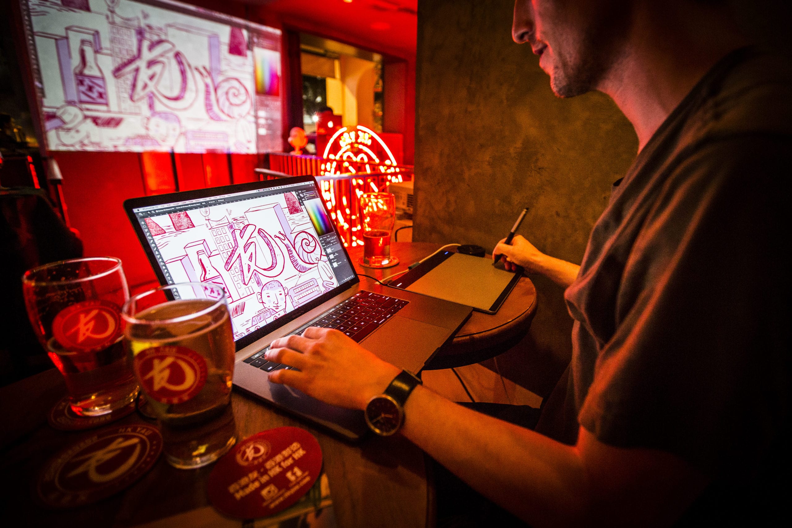 Creative designer making artworks for HK YAU in a bar