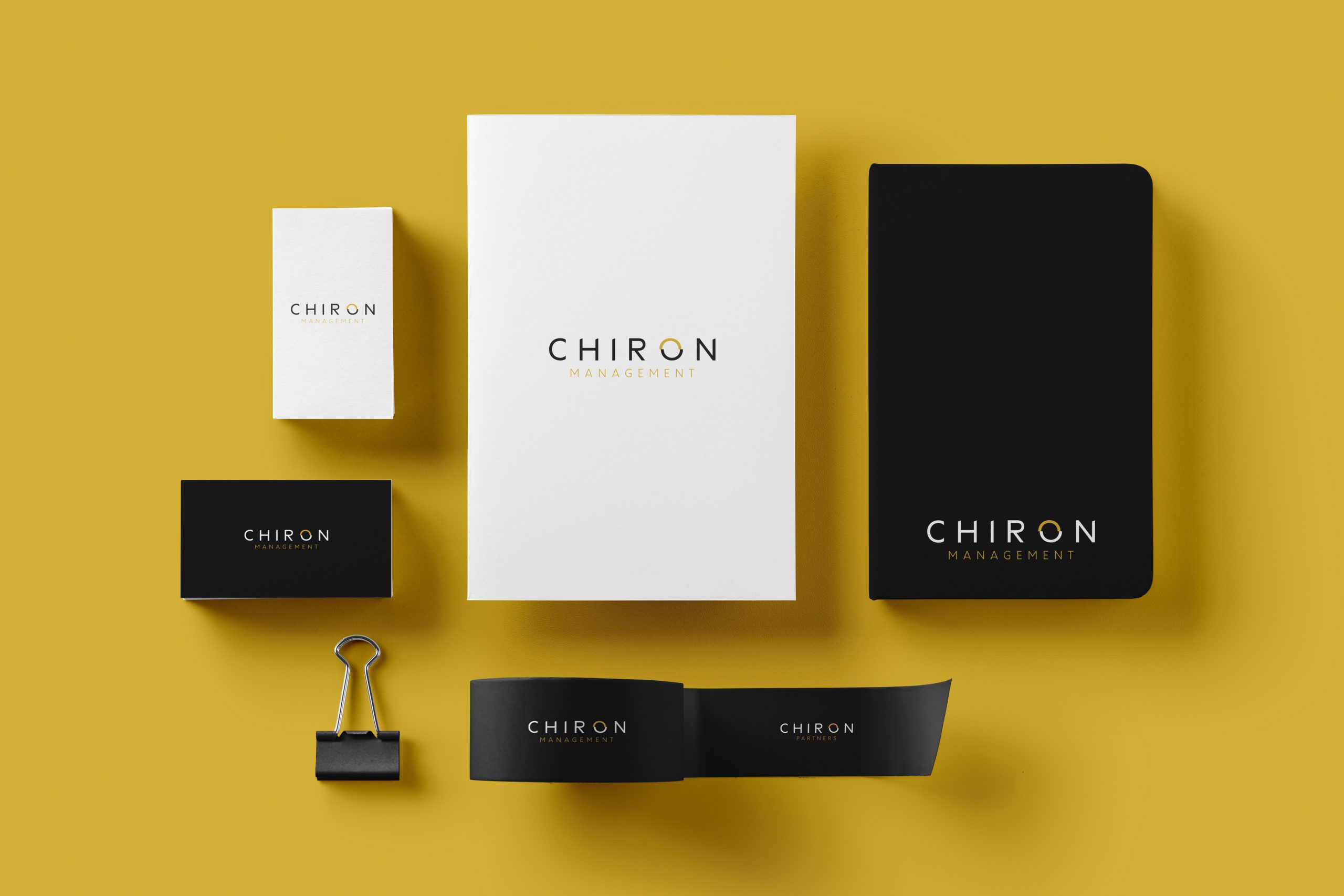 Chiron Partners stationery set on yellow background