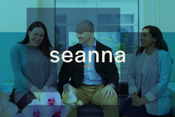 Seanna logo designed by ipulse creative agency Hong Kong overlays on top of experienced and happy recruitment team members
