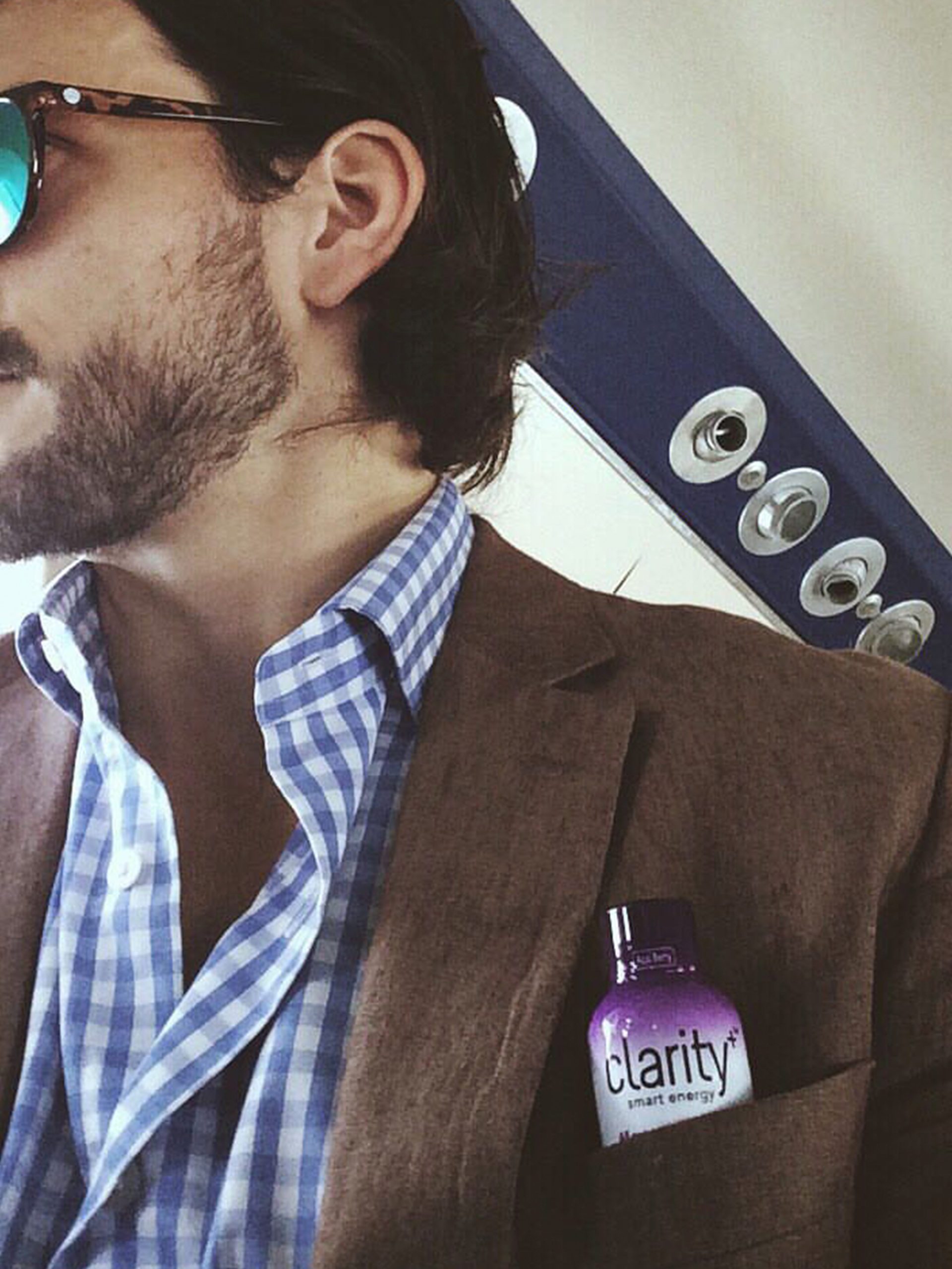 Man with casual outfit having a bottle of Clarity in his pocket