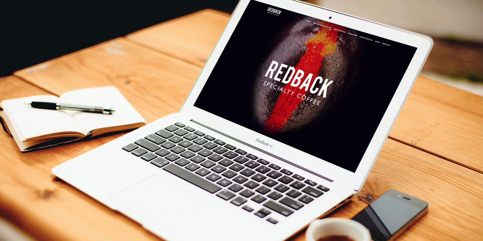 Redback Coffee website on laptop screen