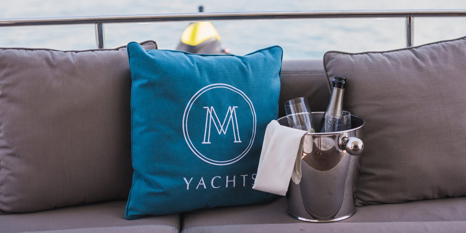 M Yachts Branding Logo On Cushion Sitting On The Boat