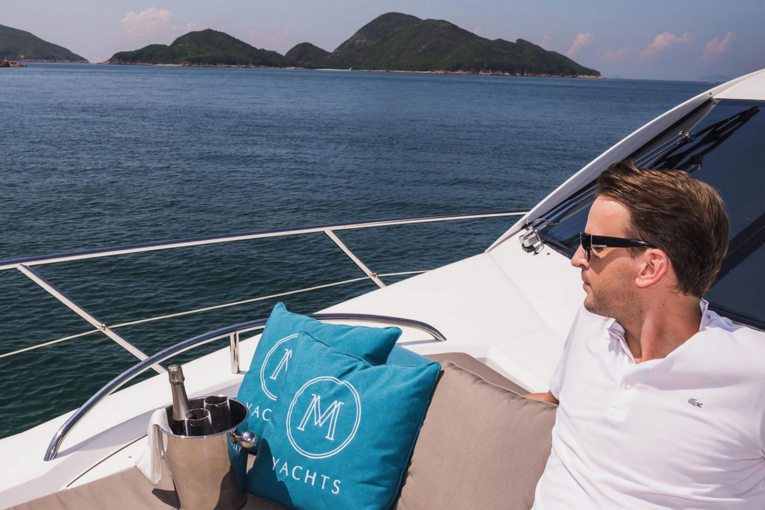 M Yachts Branding Man Sitting On The Boat