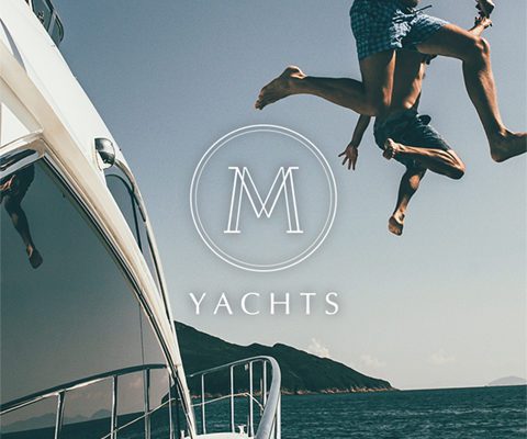 M Yachts Logo Overlay With Happy People Jumping Off The Boat