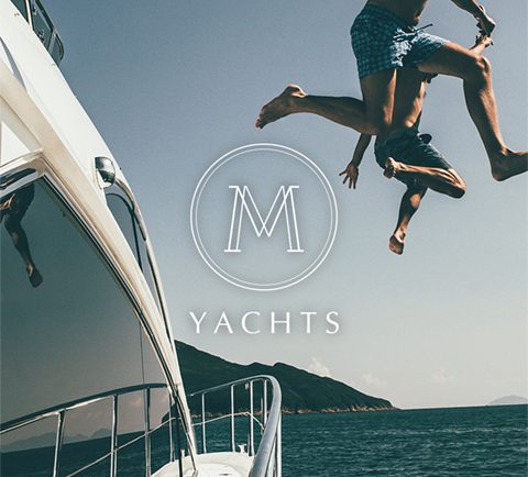 M Yachts Logo Overlay With Happy People Jumping Off The Boat