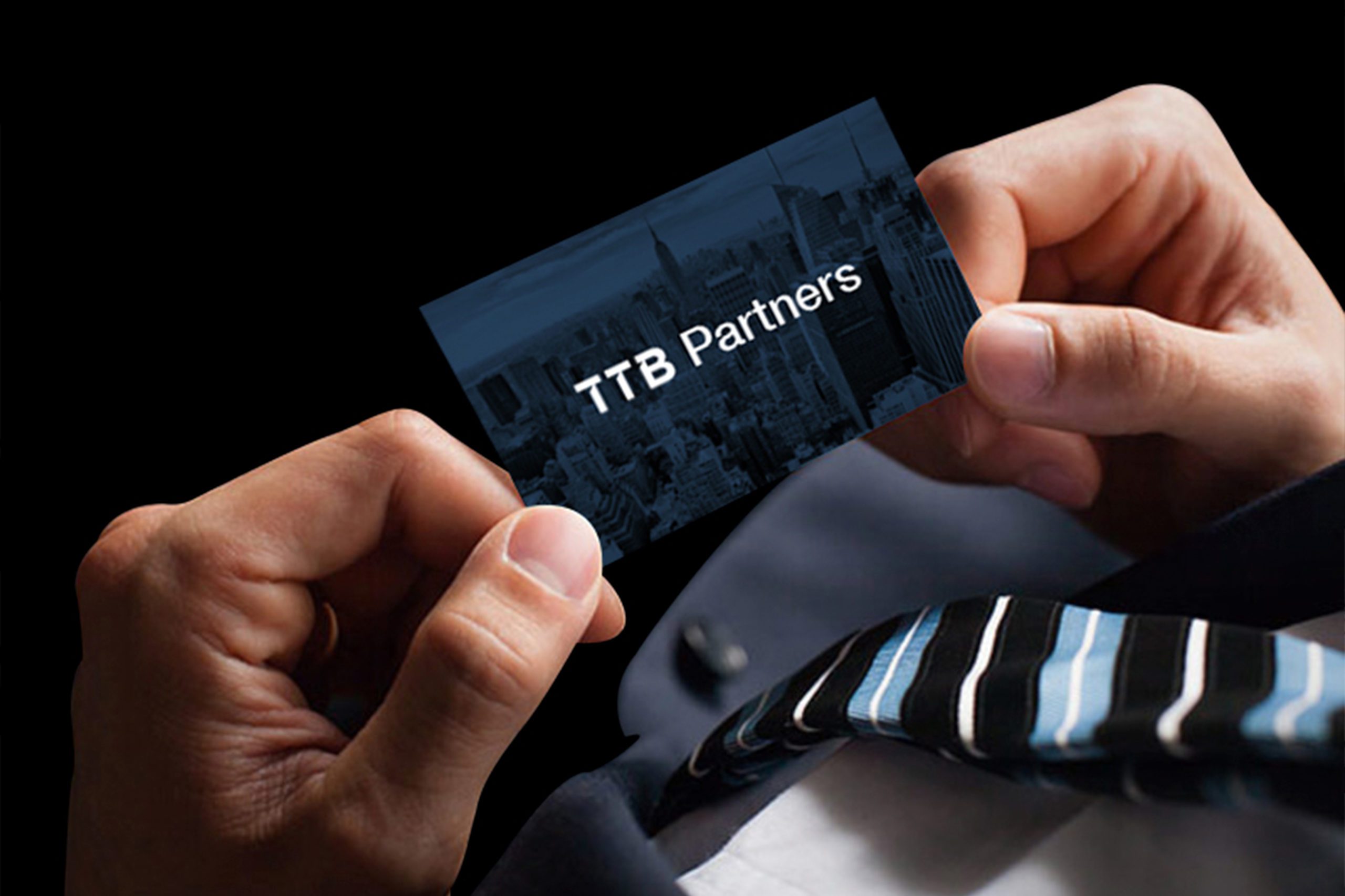 TTB Partners Branding Looking Down At Business Card