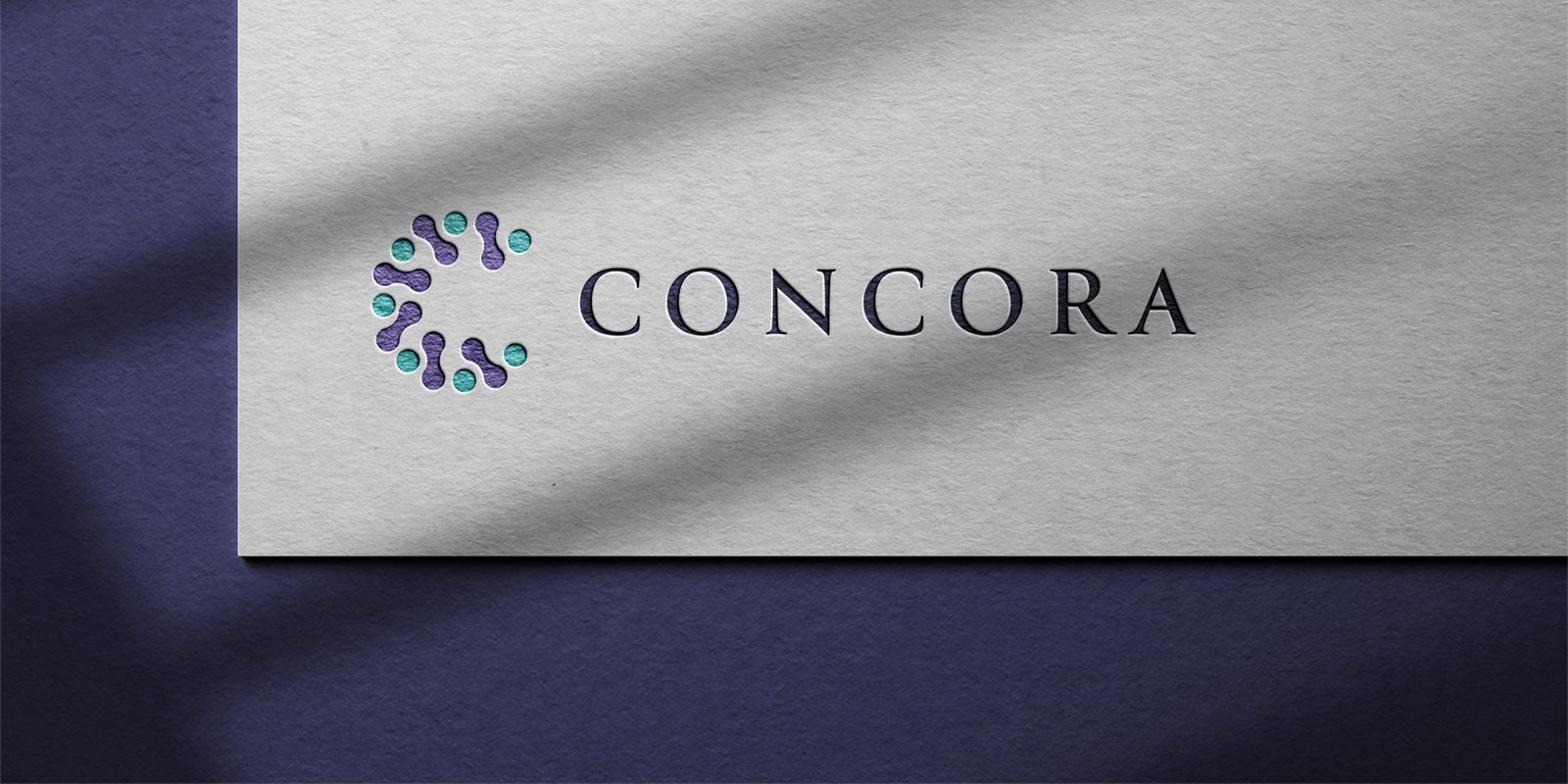 Concora Branding logo printed on textured paper with soft light