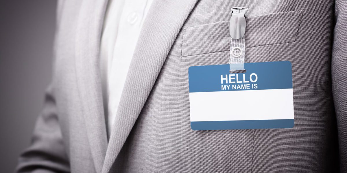 businessman wearing hello my name is tag