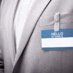 businessman wearing hello my name is tag